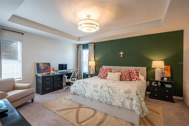 a bedroom with a bed and cabinets