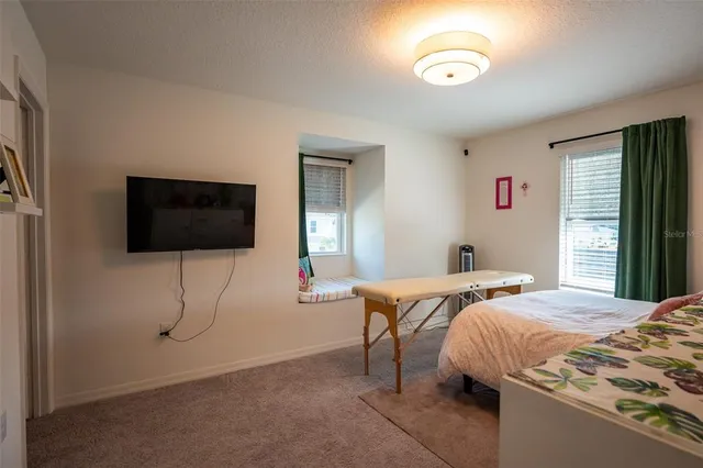 a building outdoor space with patio furniture and garden