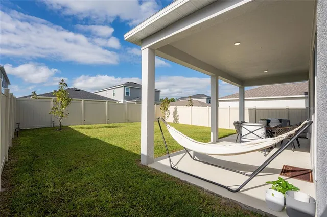 a patio with table and chairs