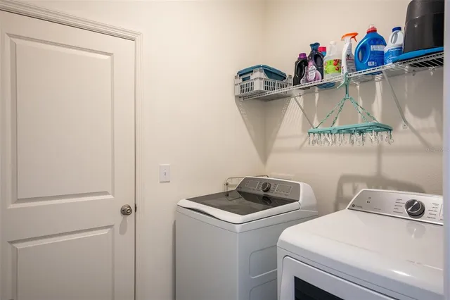 a utility room with dryer and washer