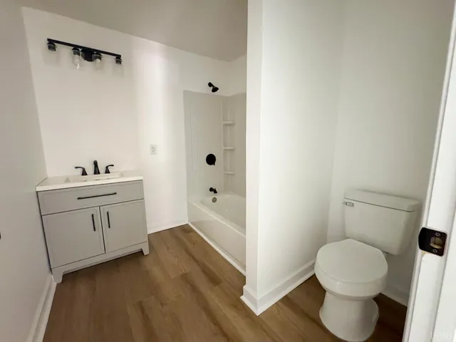 a bathroom with a toilet sink and a bathtub