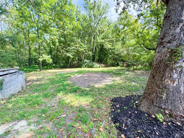 a view of outdoor space with deck and yard