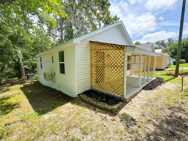 a view of a backyard with a small cabin