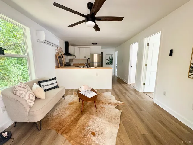 a living room with furniture and a window