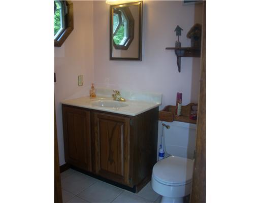100 Shady Spring Road Economy, PA 15005 - Photo 12 of 18 Partial Bath. Nice partial bath tucked away from the main living areas with a beautiful octagon window to allow for direct natural lighting.