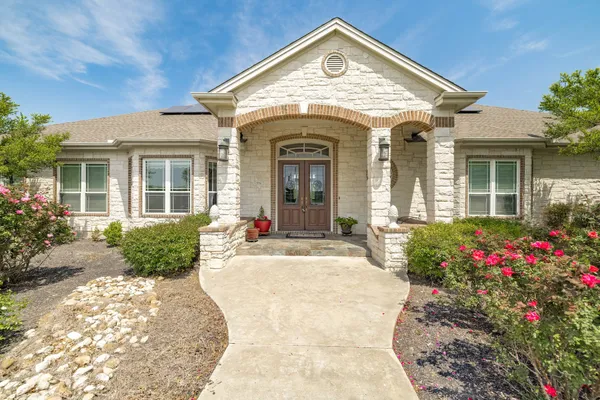 a view of a livingroom with furniture and a window