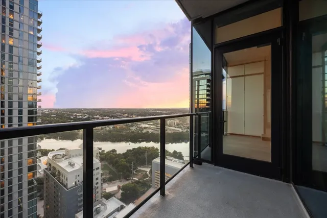 a view of entrance gate of a house with a bench