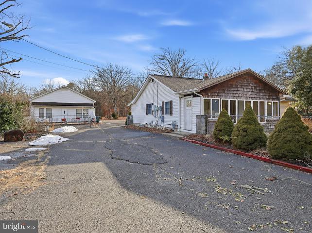 2384 Winslow Road Williamstown, NJ 08094 - Photo 18 of 45 a front view of a house with a yard and potted plants