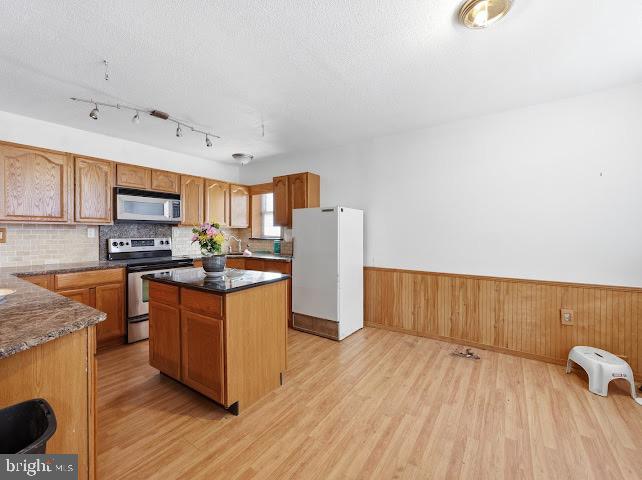 2384 Winslow Road Williamstown, NJ 08094 - Photo 26 of 45 a kitchen with stainless steel appliances granite countertop a refrigerator a stove and a wooden floors