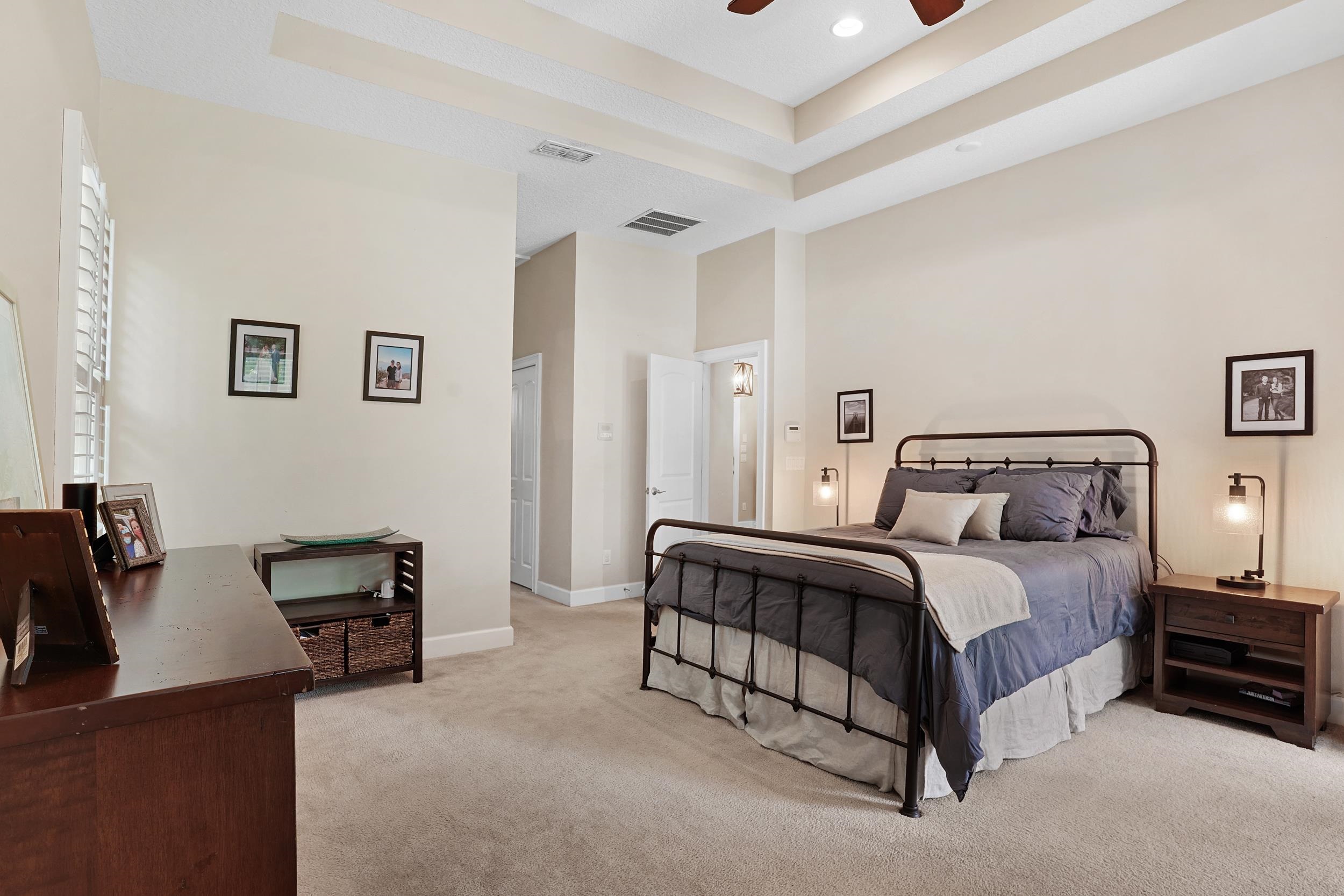 1308 Acorn Ridge Court St. Augustine, FL 32092 - Photo 19 of 47 a spacious bedroom with a bed and furniture