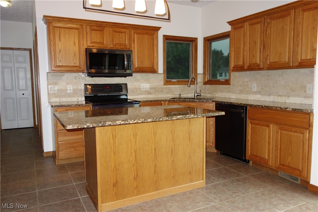 4891 Edson Road Kent, OH 44240 - Photo 14 of 48 Oak Cabinetry and newer stainless appliances