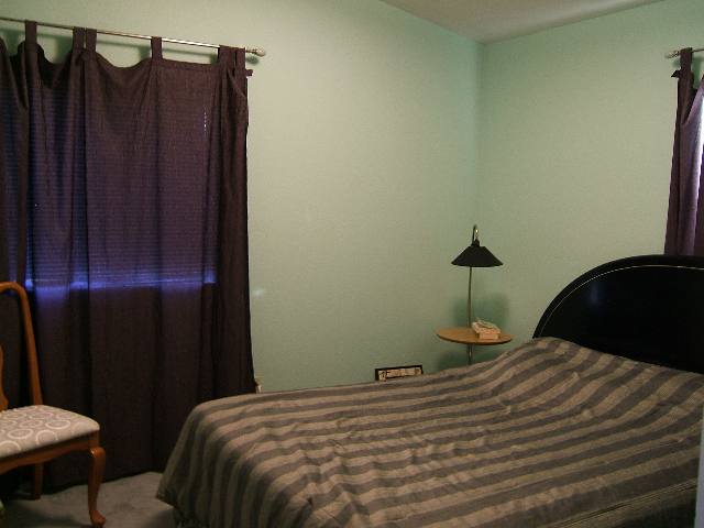 2181 Cobblestone Court Reno, NV 89503 - Photo 3 of 8 a bed sitting in a bedroom next to a bathroom