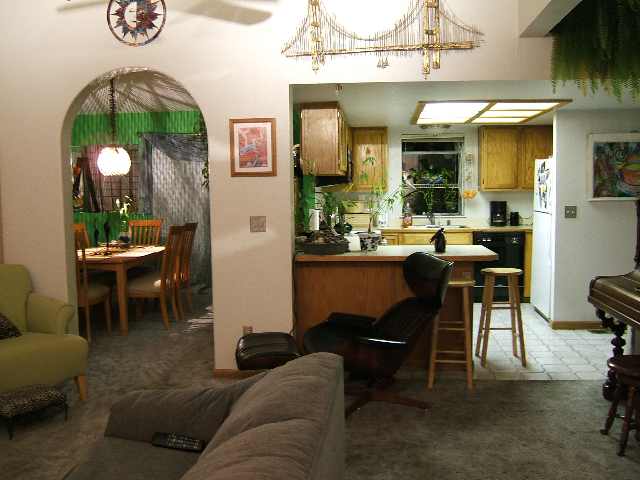 2181 Cobblestone Court Reno, NV 89503 - Photo 6 of 8 a living room with furniture a lamp paintings and a table