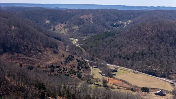 a view of a backyard with green space