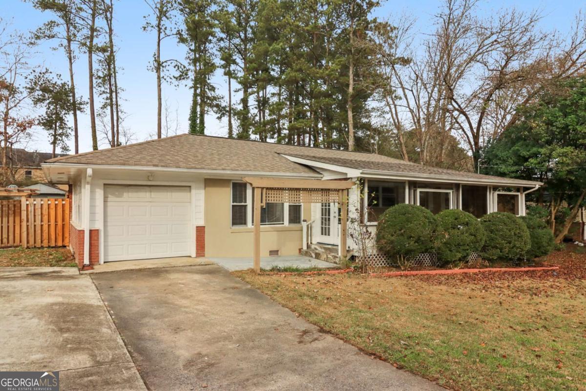 716 Carolina Roads Marietta, GA 30008 - Photo 1 of 54 a front view of a house with a garden