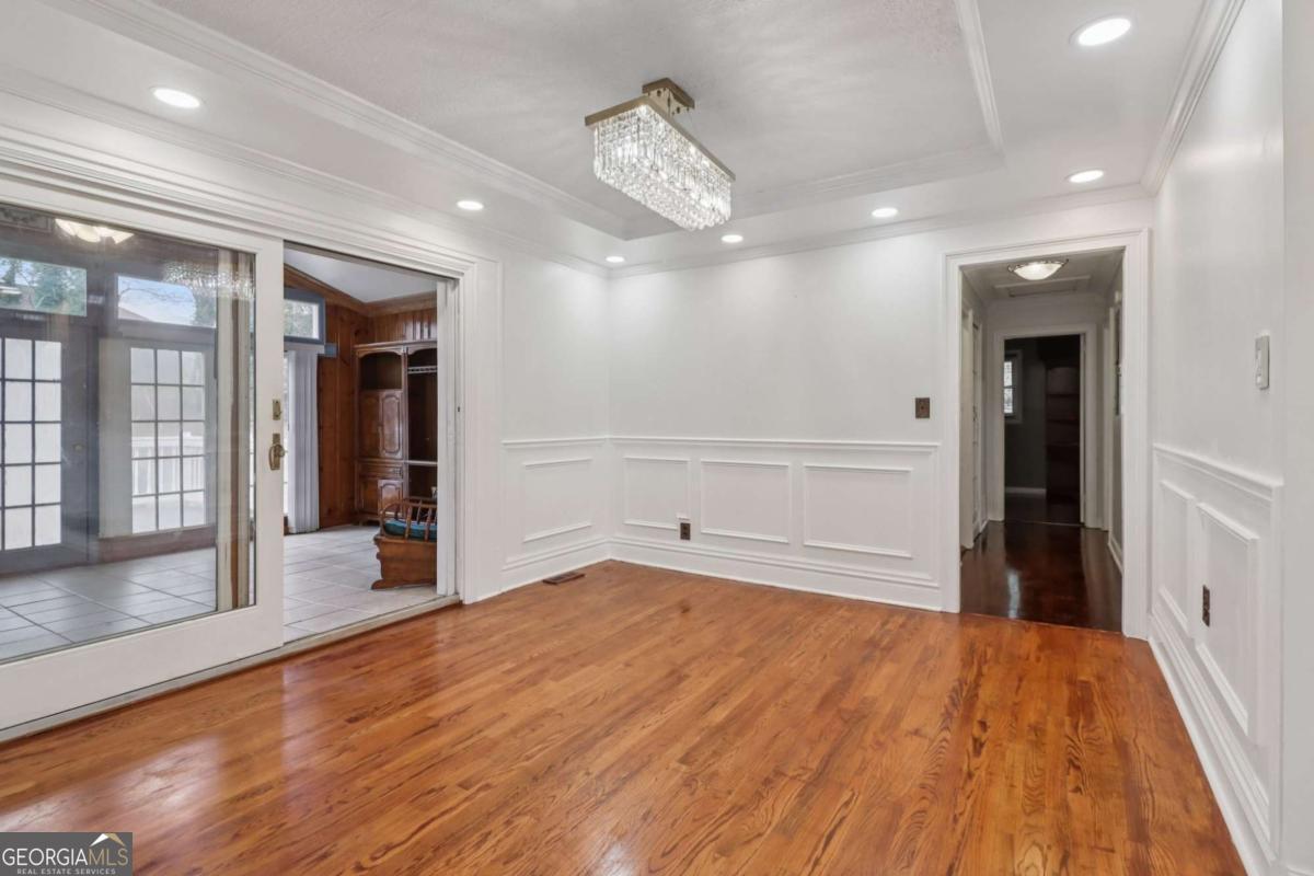 716 Carolina Roads Marietta, GA 30008 - Photo 15 of 54 a view of an empty room with wooden floor