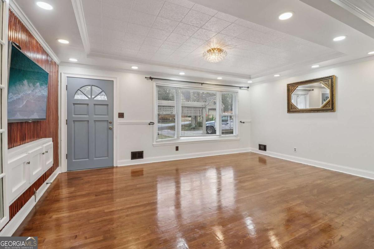716 Carolina Roads Marietta, GA 30008 - Photo 2 of 54 a view of empty room with wooden floor and window