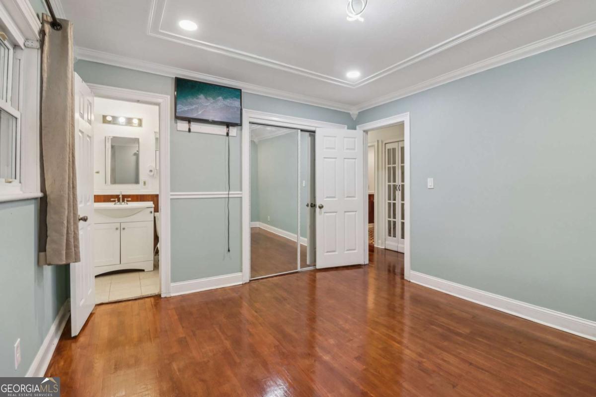 716 Carolina Roads Marietta, GA 30008 - Photo 29 of 54 a view of empty room with wooden floor and cabinets
