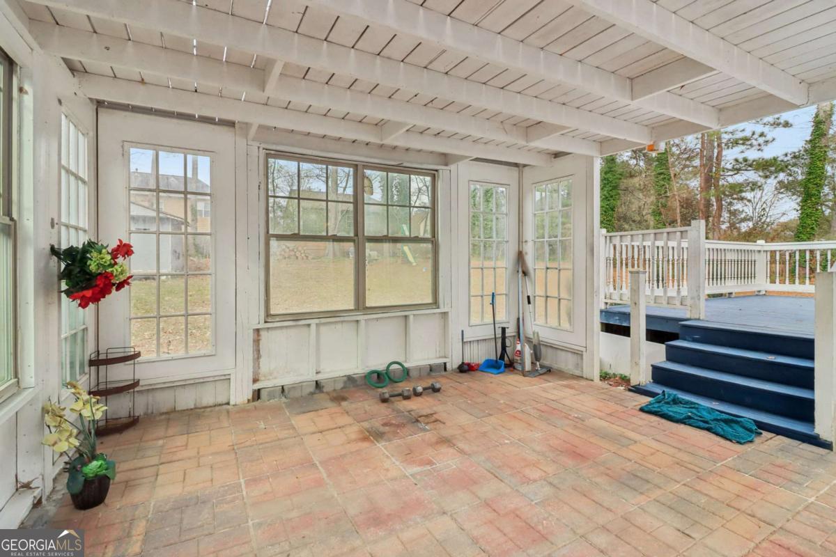 716 Carolina Roads Marietta, GA 30008 - Photo 35 of 54 a view of a porch with a bench