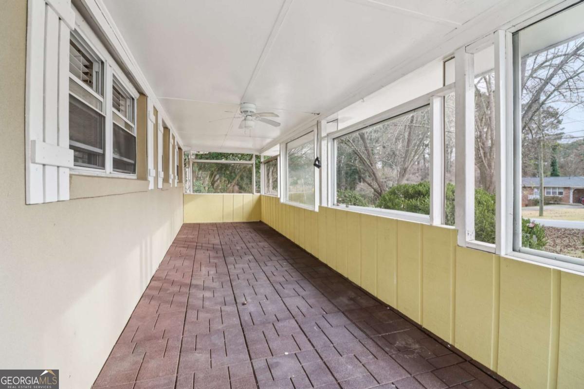 716 Carolina Roads Marietta, GA 30008 - Photo 36 of 54 a view of an empty room with wooden floor and a window