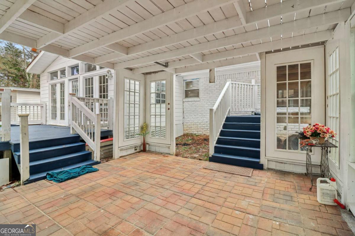 716 Carolina Roads Marietta, GA 30008 - Photo 37 of 54 a view of entryway with wooden floor and a chandelier