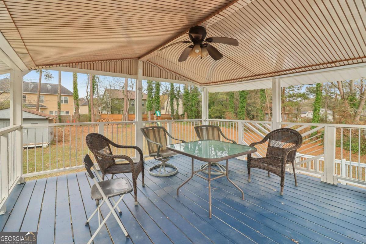 716 Carolina Roads Marietta, GA 30008 - Photo 39 of 54 a view of a porch with furniture and a yard