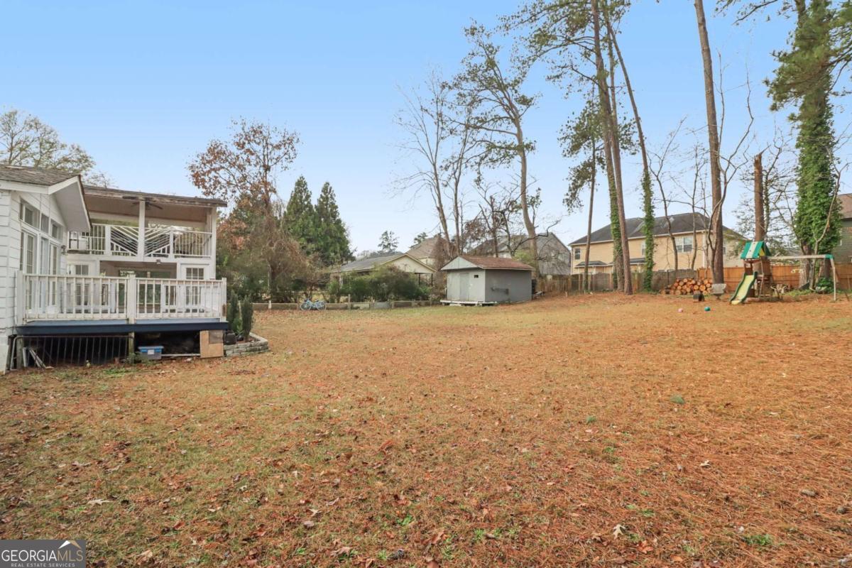 716 Carolina Roads Marietta, GA 30008 - Photo 49 of 54 a view of a house with yard and covered with snow in the background