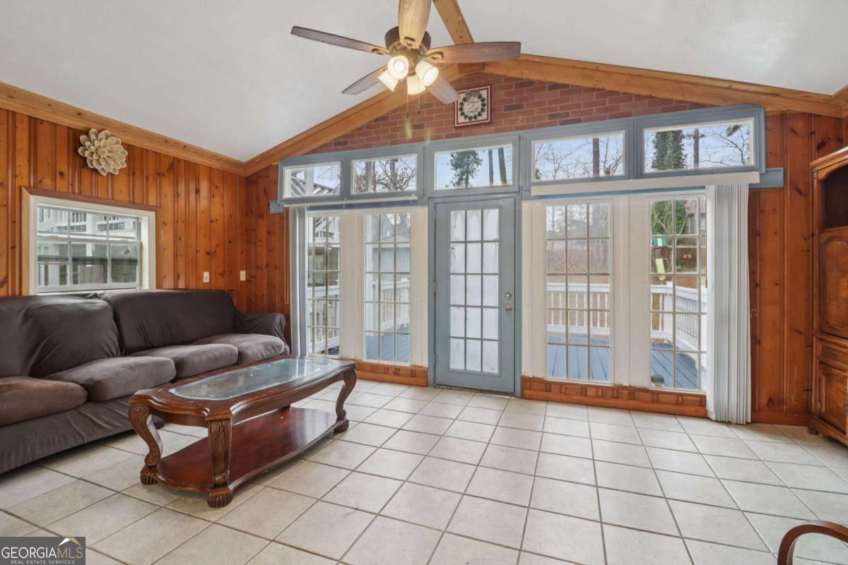 716 Carolina Roads Marietta, GA 30008 - Photo 8 of 54 a living room with furniture and a floor to ceiling window