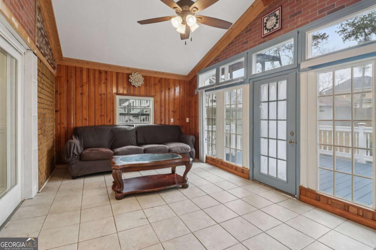 716 Carolina Roads Marietta, GA 30008 - Photo 10 of 54 a living room with furniture and a large window