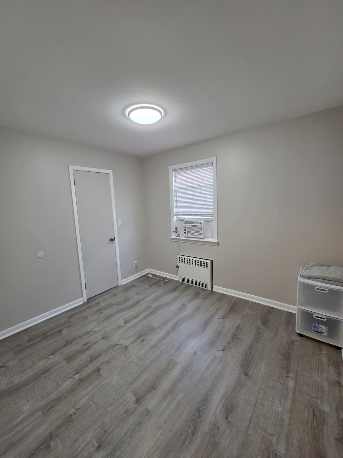 166 Carmita Avenue, Unit 2 Rutherford, NJ 07070 - Photo 13 of 27 an empty room with windows
