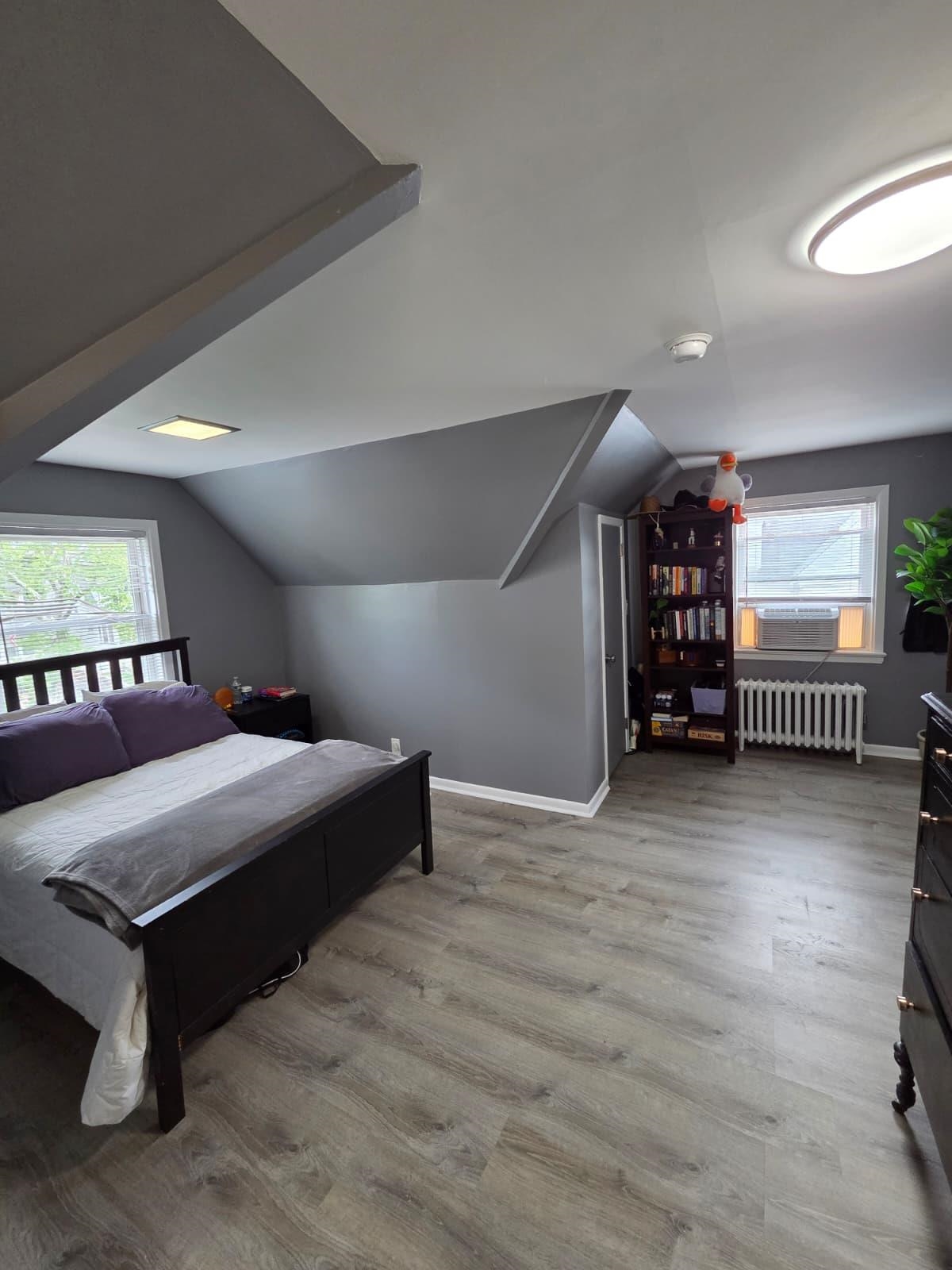 166 Carmita Avenue, Unit 2 Rutherford, NJ 07070 - Photo 19 of 27 a spacious bedroom with a bed and a desk in it