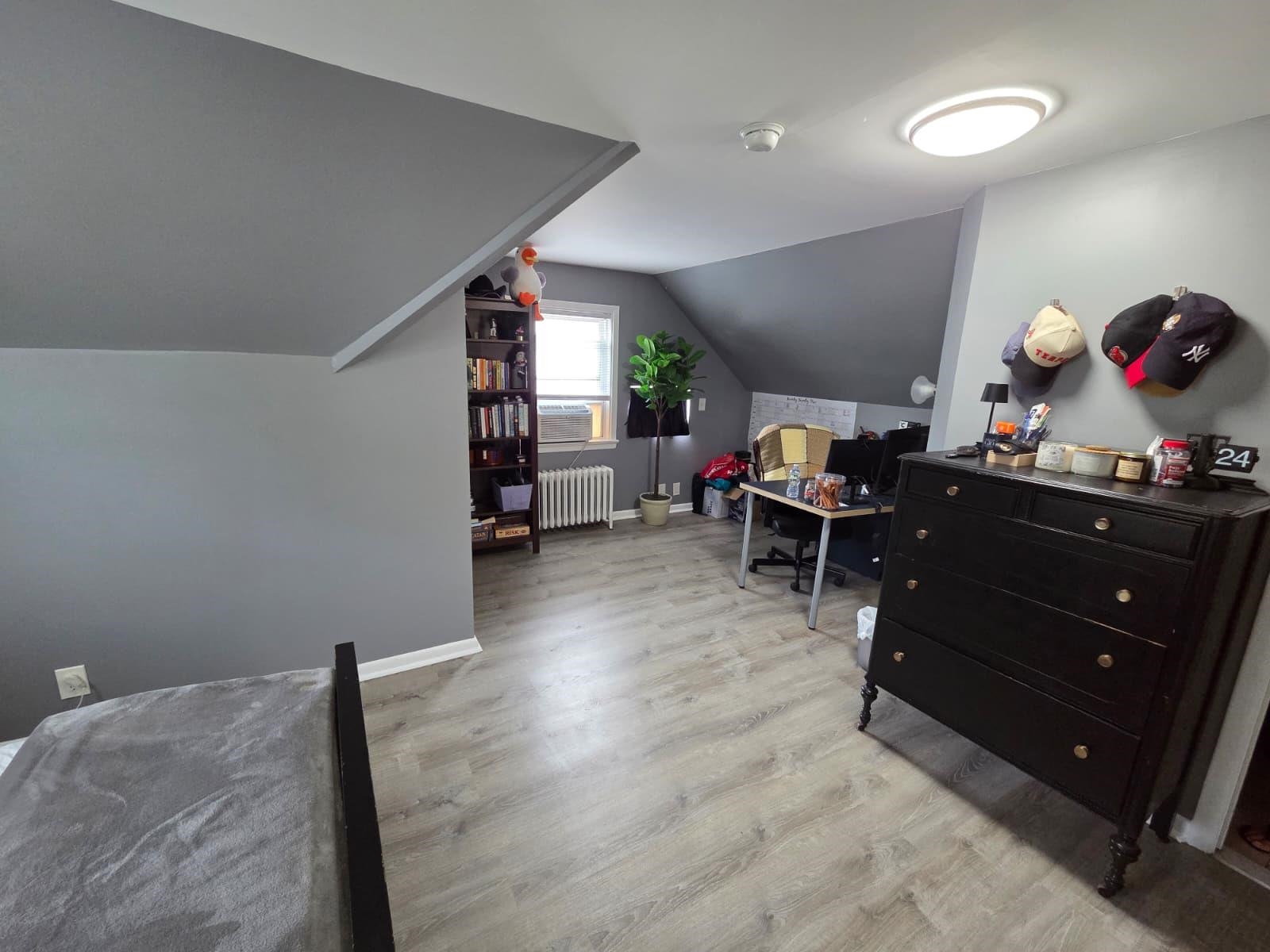 166 Carmita Avenue, Unit 2 Rutherford, NJ 07070 - Photo 21 of 27 a living room with furniture and a wooden floor