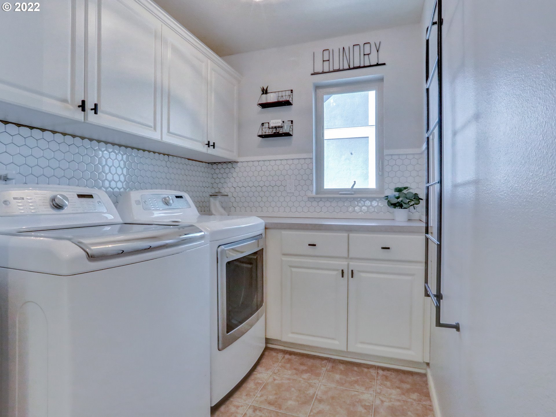 1098 Epperly Way West Linn, OR 97068 - Photo 29 of 32 a utility room with cabinets washer and dryer