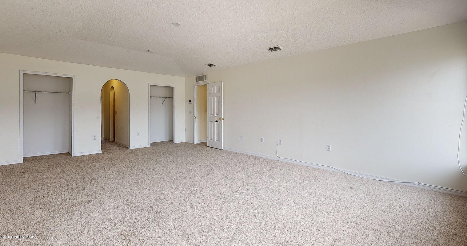 11939 Iron Creek Road Jacksonville, FL 32218 - Photo 16 of 45 a view of a room that has a lot of windows