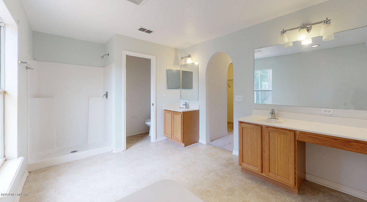 11939 Iron Creek Road Jacksonville, FL 32218 - Photo 17 of 45 a bathroom with a sink and a mirror