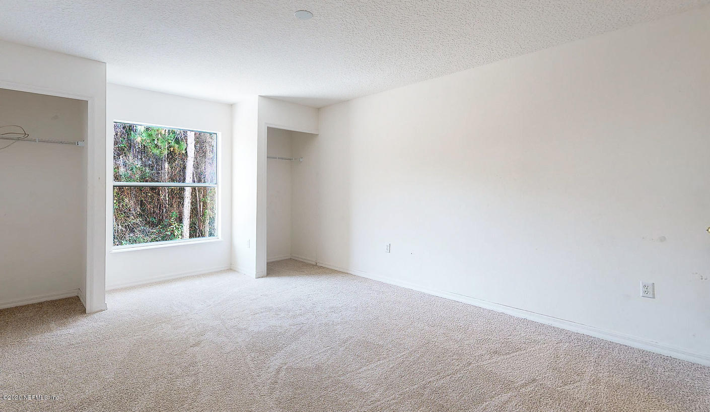 11939 Iron Creek Road Jacksonville, FL 32218 - Photo 19 of 45 an empty room with windows