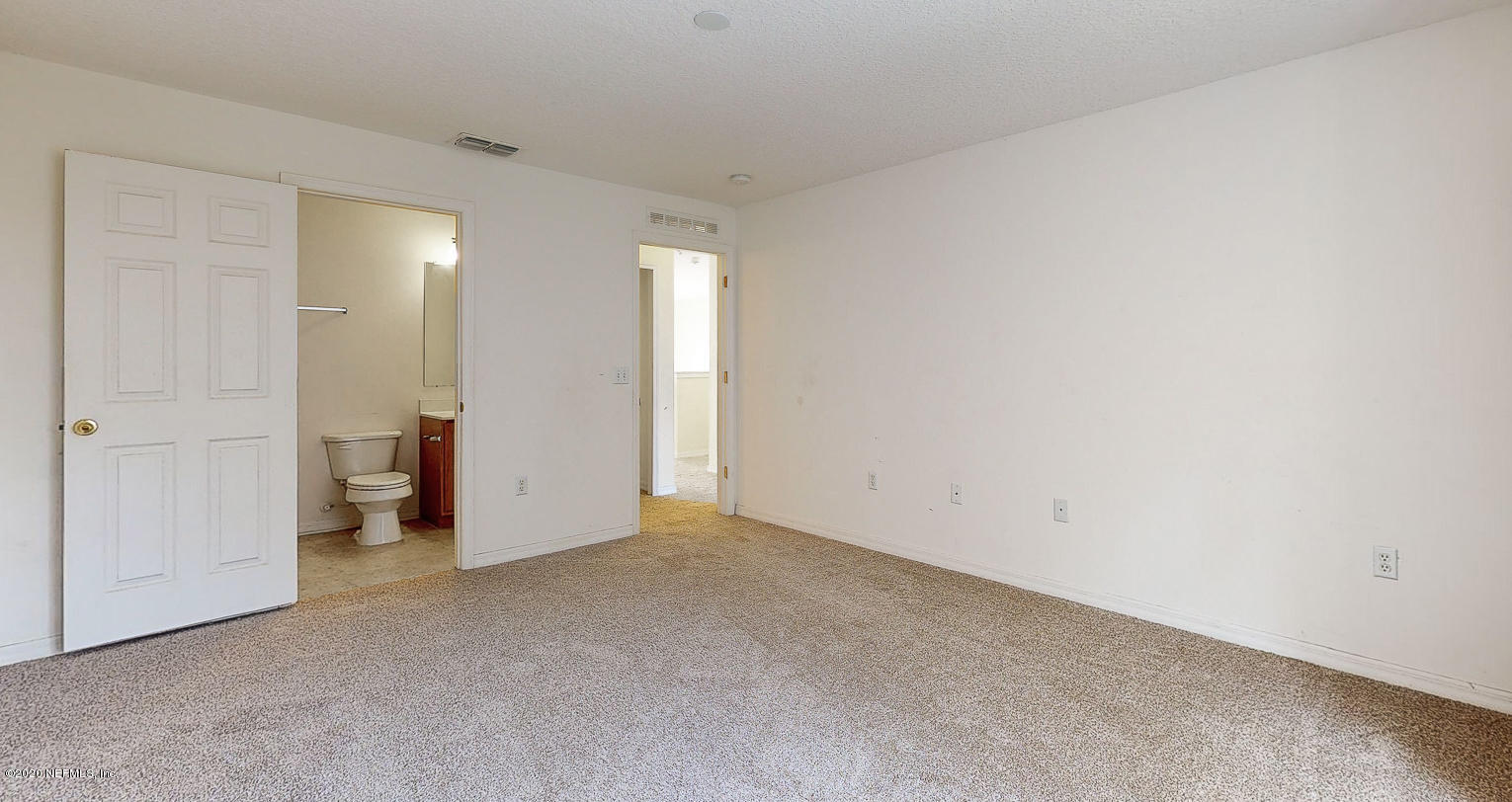 11939 Iron Creek Road Jacksonville, FL 32218 - Photo 20 of 45 an empty room with an entryway
