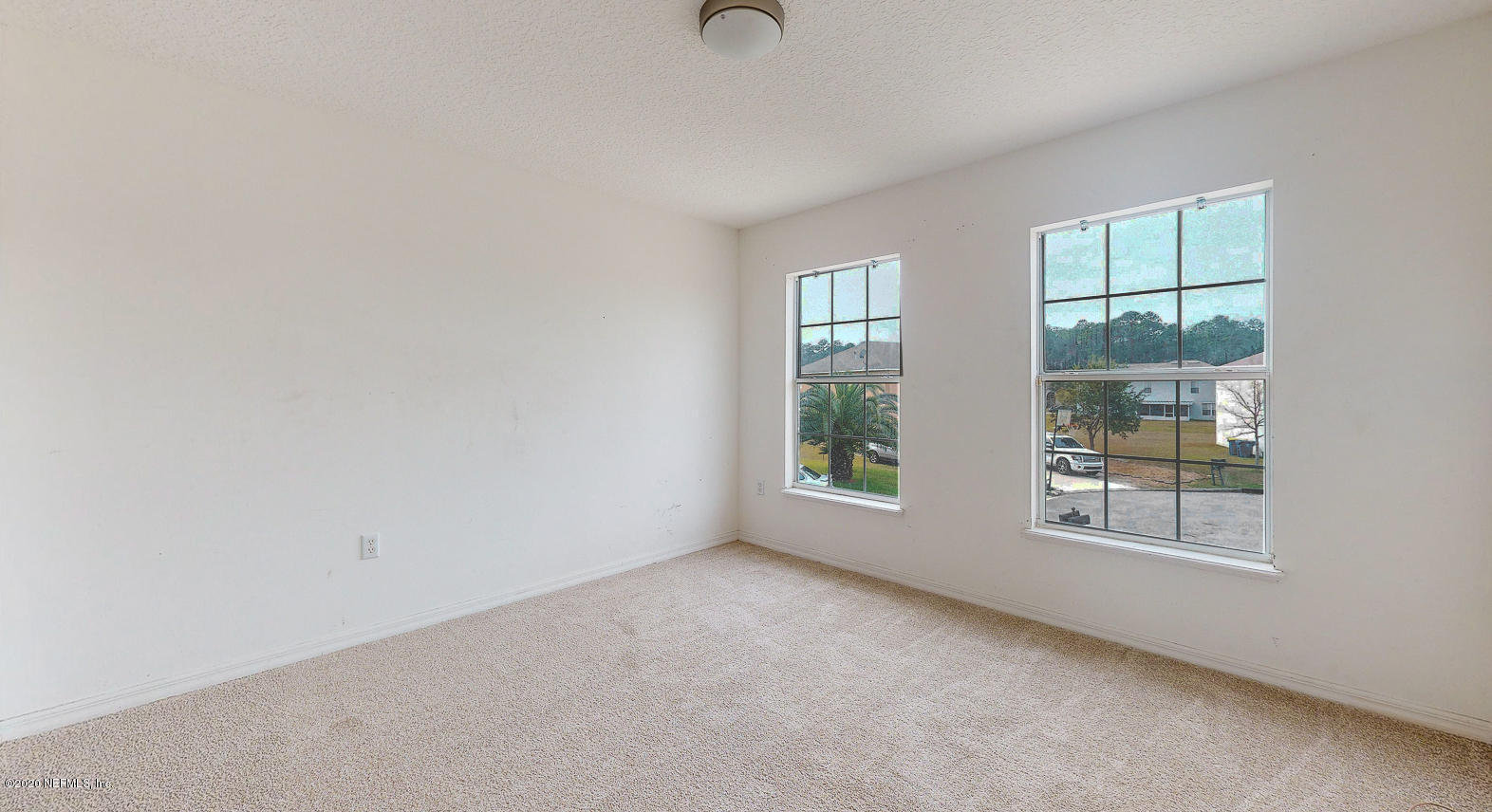 11939 Iron Creek Road Jacksonville, FL 32218 - Photo 28 of 45 an empty room with windows