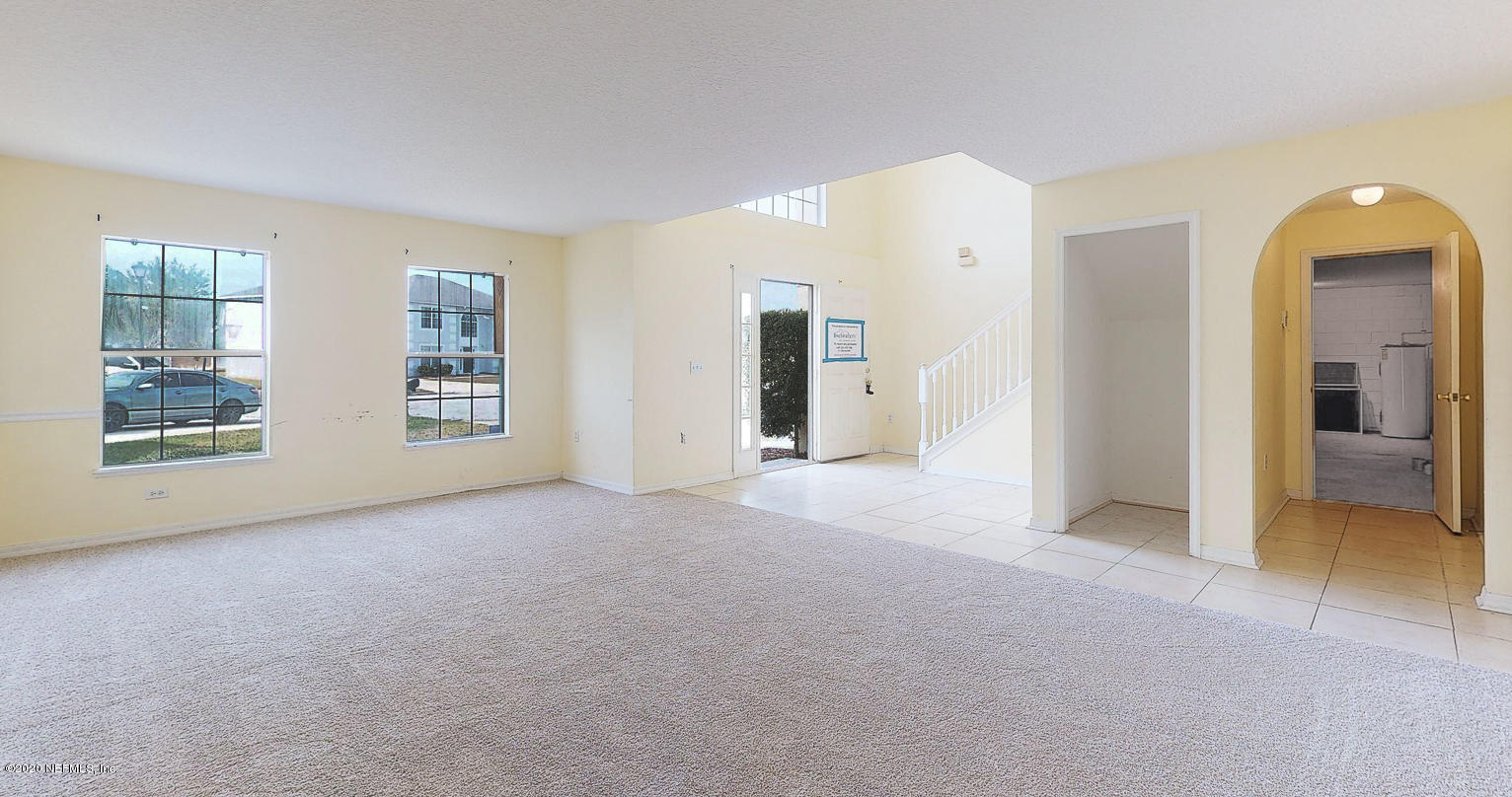 11939 Iron Creek Road Jacksonville, FL 32218 - Photo 3 of 45 a view of empty room with windows and wardrobe