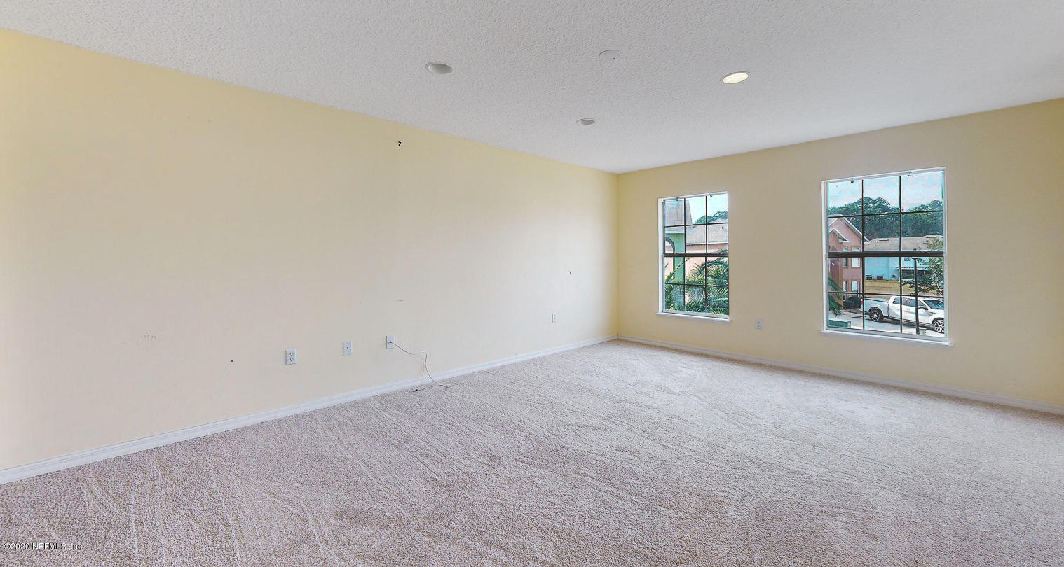 11939 Iron Creek Road Jacksonville, FL 32218 - Photo 31 of 45 an empty room with windows