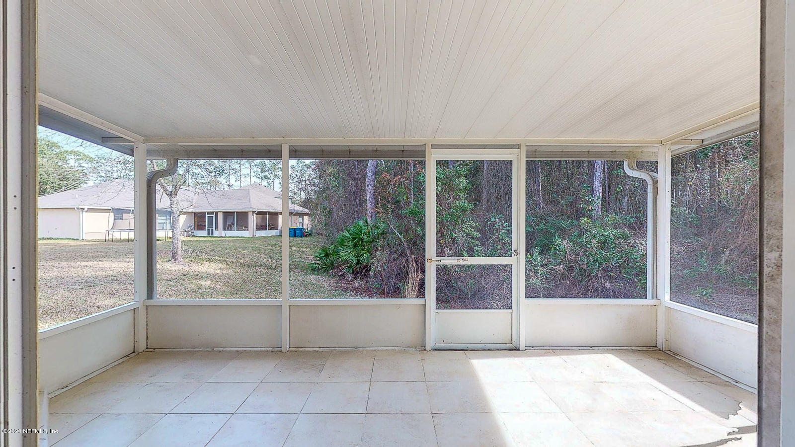 11939 Iron Creek Road Jacksonville, FL 32218 - Photo 32 of 45 a view of an empty room with a fireplace and a large window