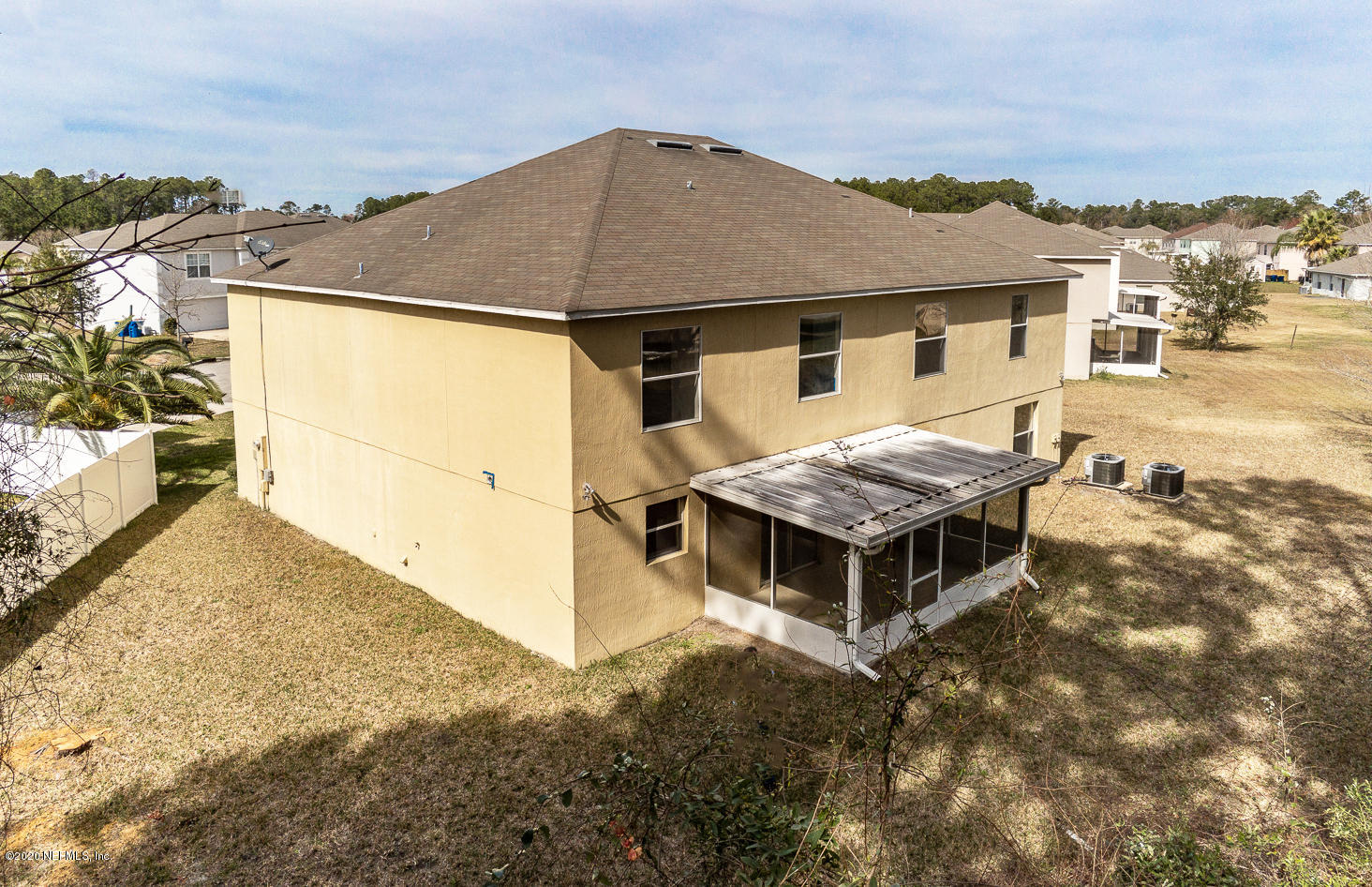 11939 Iron Creek Road Jacksonville, FL 32218 - Photo 42 of 45 a aerial view of a house with a yard