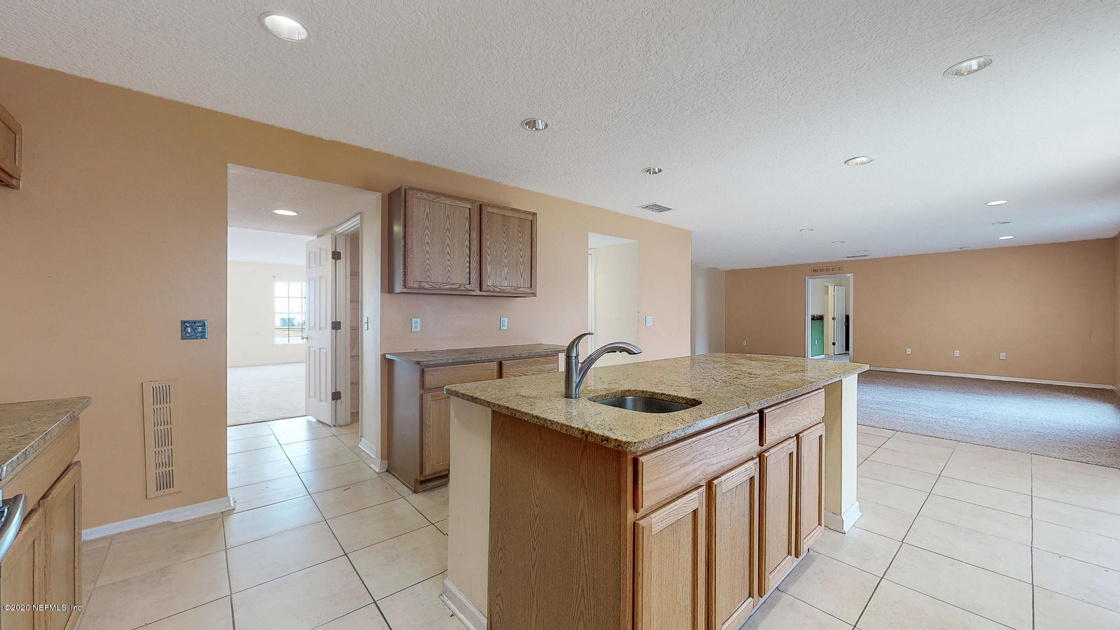 11939 Iron Creek Road Jacksonville, FL 32218 - Photo 6 of 45 a kitchen that has a sink and a stove