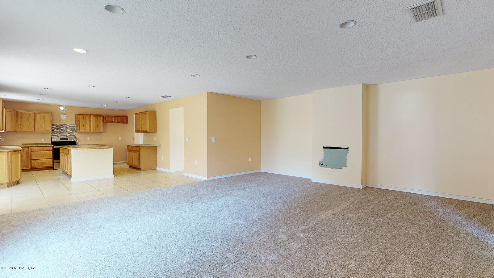11939 Iron Creek Road Jacksonville, FL 32218 - Photo 9 of 45 a view of a livingroom with kitchen and furniture