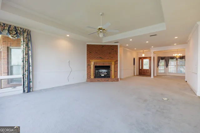 a view of an empty room with a fireplace