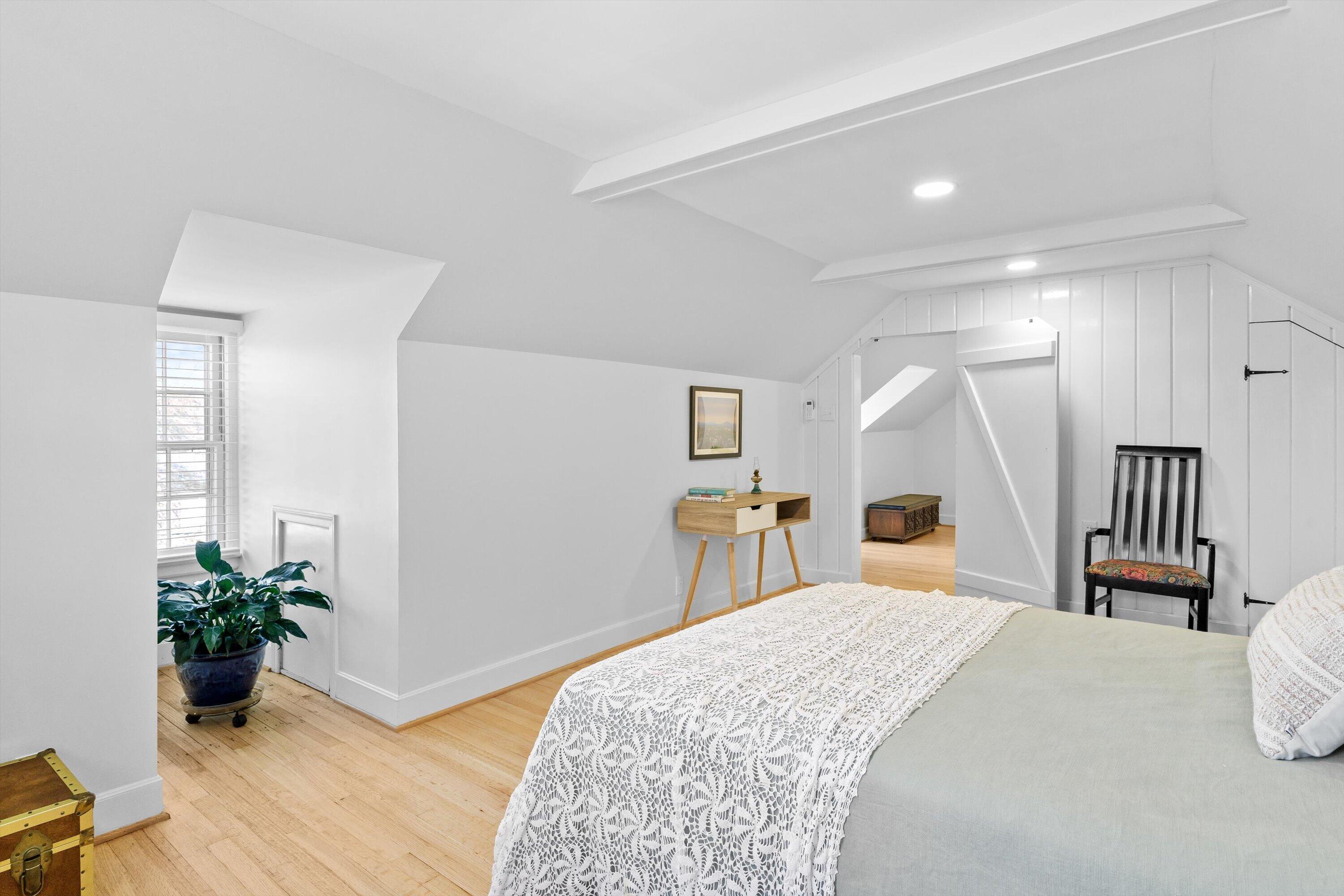 2650 Laburnum Avenue Southwest Roanoke, VA 24015 - Photo 29 of 37 a spacious bedroom with a bed and a potted plant