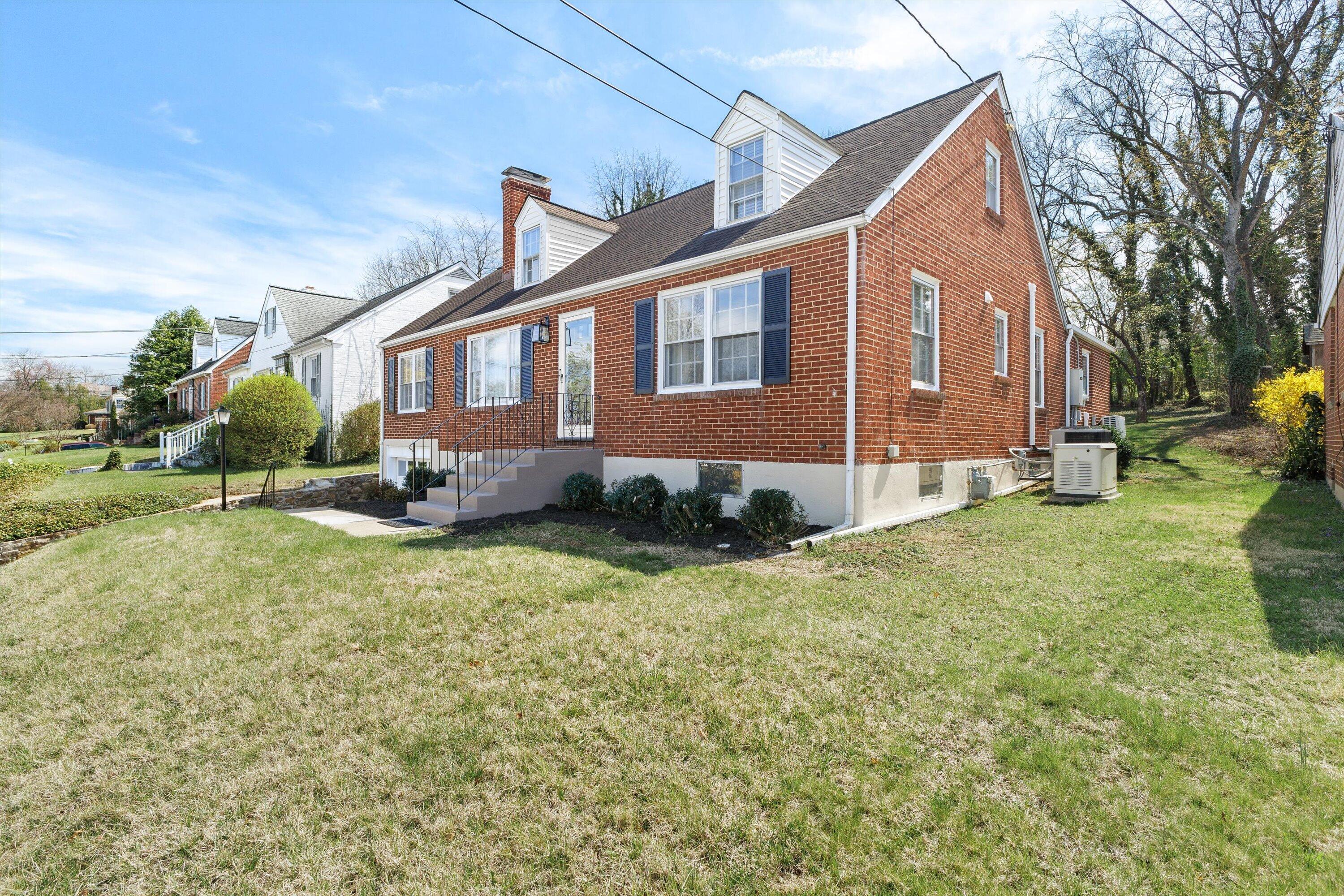 2650 Laburnum Avenue Southwest Roanoke, VA 24015 - Photo 3 of 37 a front view of a house with a yard