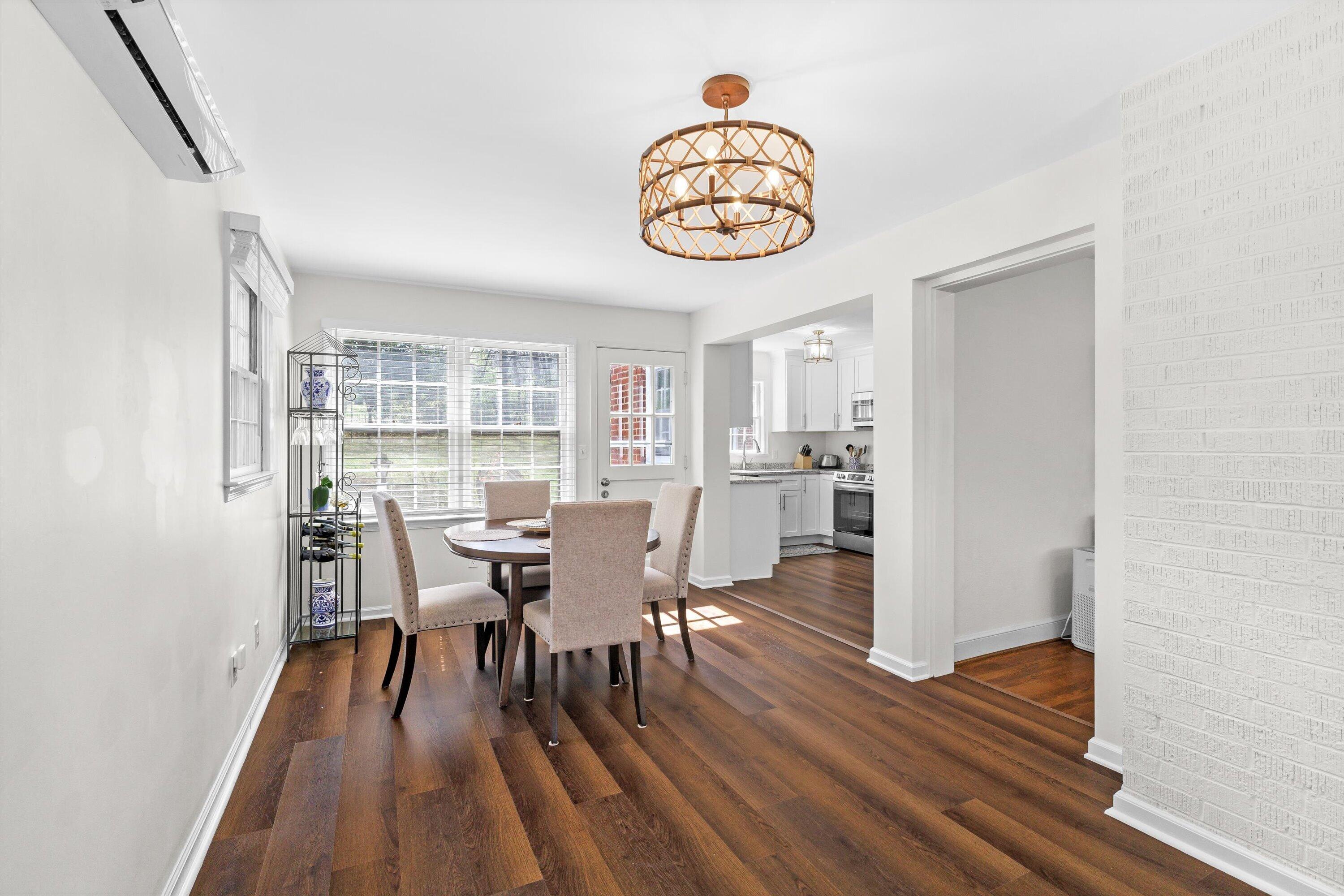 2650 Laburnum Avenue Southwest Roanoke, VA 24015 - Photo 9 of 37 a view of a dining room with furniture window and wooden floor