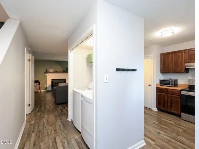 a view of a kitchen from the hallway