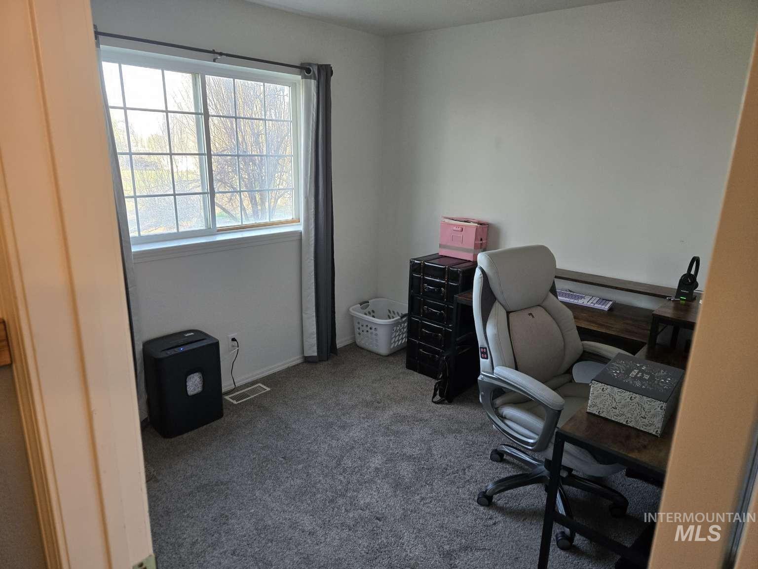 1065 Loafer Lane Weiser, ID 83672 - Photo 14 of 36 Office featuring dark colored carpet and baseboards